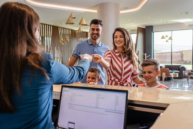 family checkin in at hotel