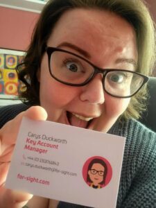 Carys holding For-Sight business card
