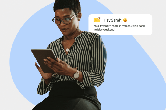 Woman holding tablet with email notification